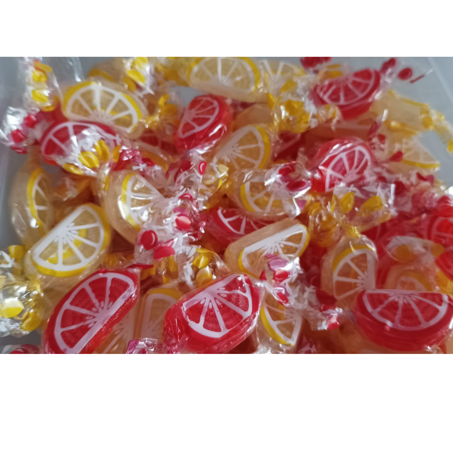 caramelos con forma de gajos naranja o limon santos